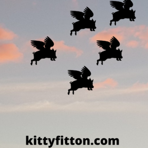 silhouette of flying pigs against a blue sky with pink fluffy clouds. 